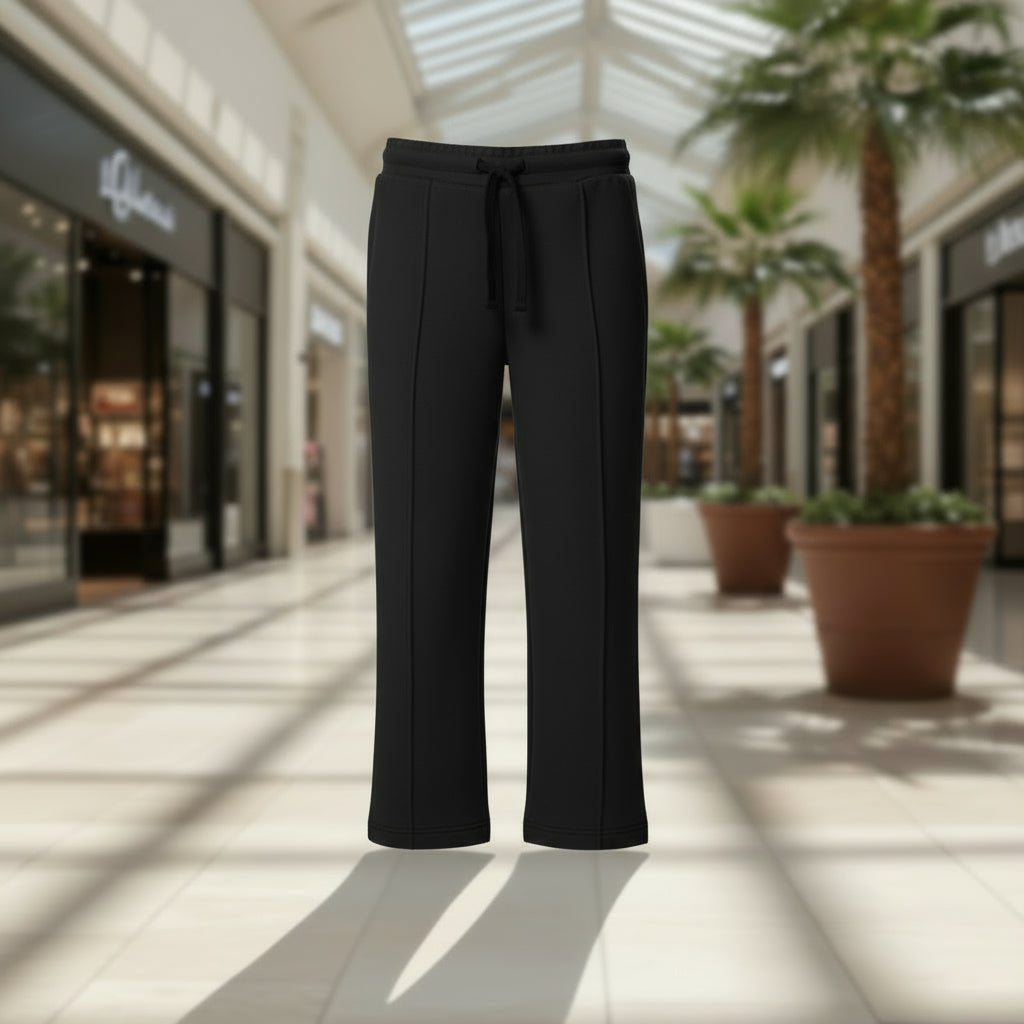 Gray sweatpants with a white drawstring in a mall setting