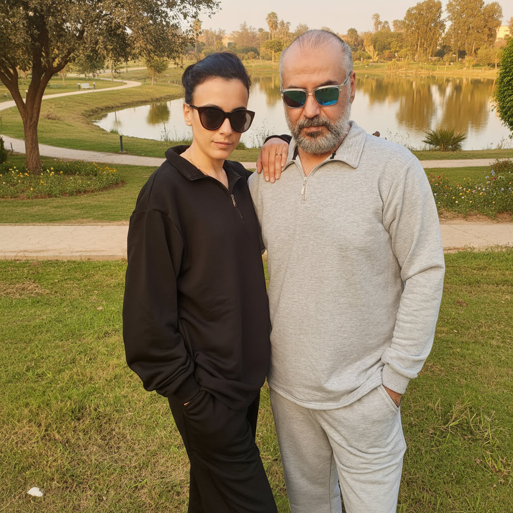 Two people standing outdoors in a lake park.